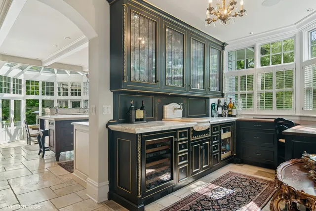 a kitchen with a stove a sink and a cabinets