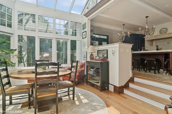 a dining room with furniture and a fireplace