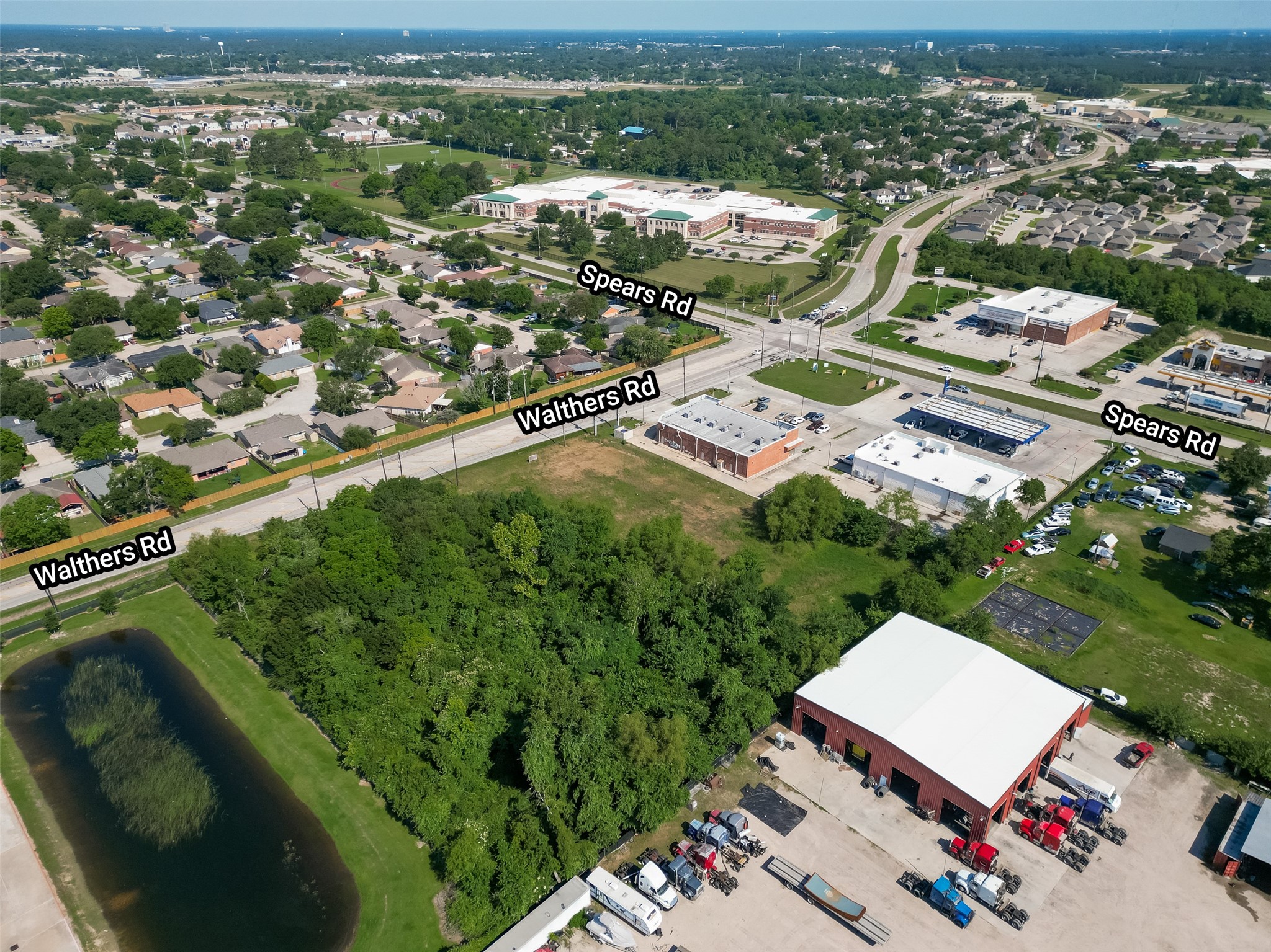 11966 Walters Road Houston, TX 77067 - Photo 2 of 23 an aerial view of residential houses with outdoor space