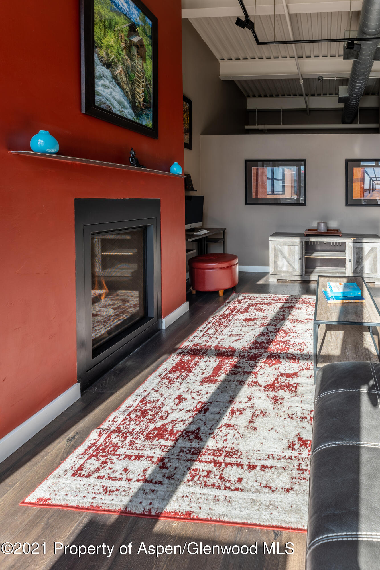 231 Robinson Street, Unit 306 Basalt, CO 81621 - Photo 11 of 15 a living room with couch and a fireplace