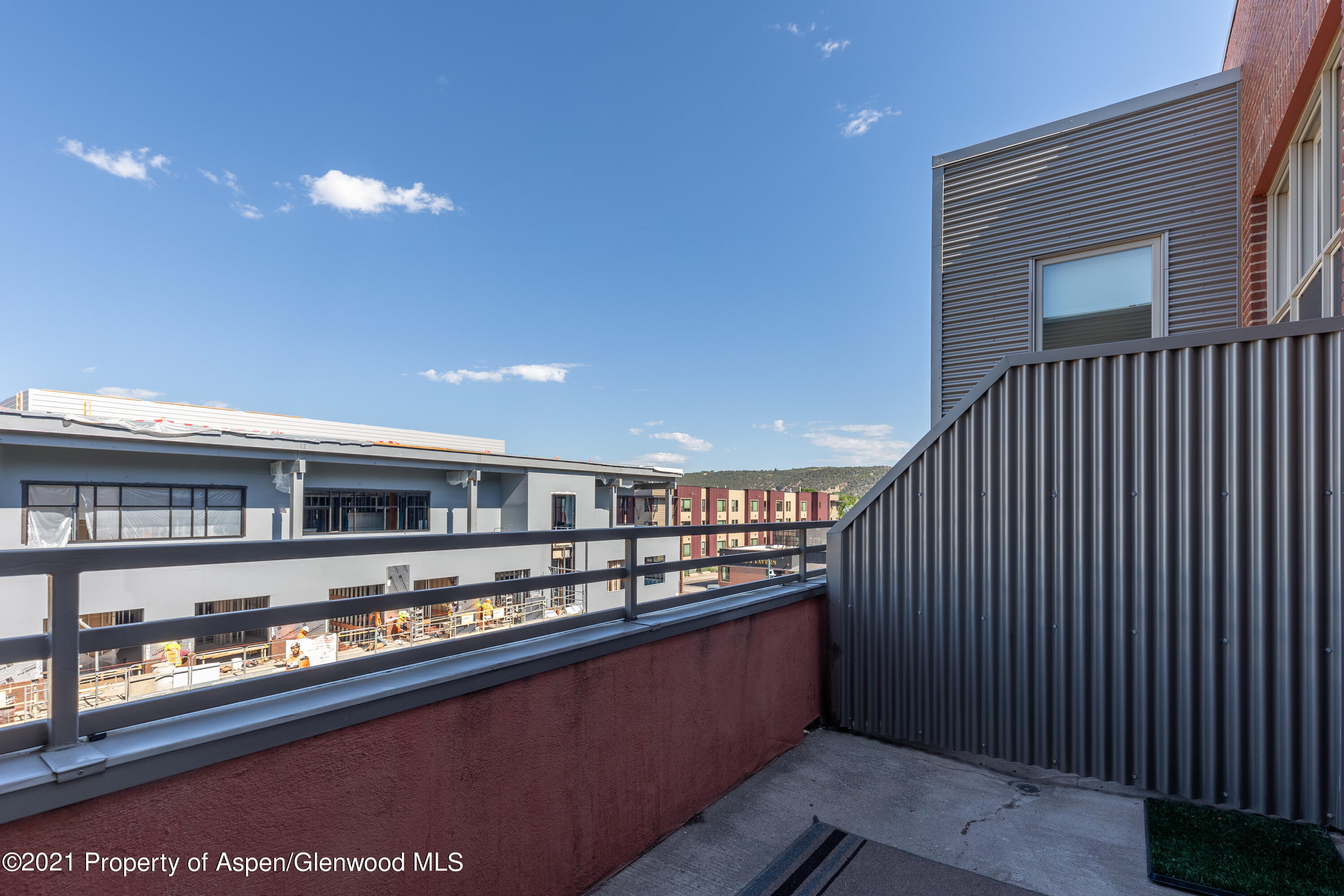 231 Robinson Street, Unit 306 Basalt, CO 81621 - Photo 13 of 15 a living room with stainless steel appliances granite countertop furniture and a kitchen view
