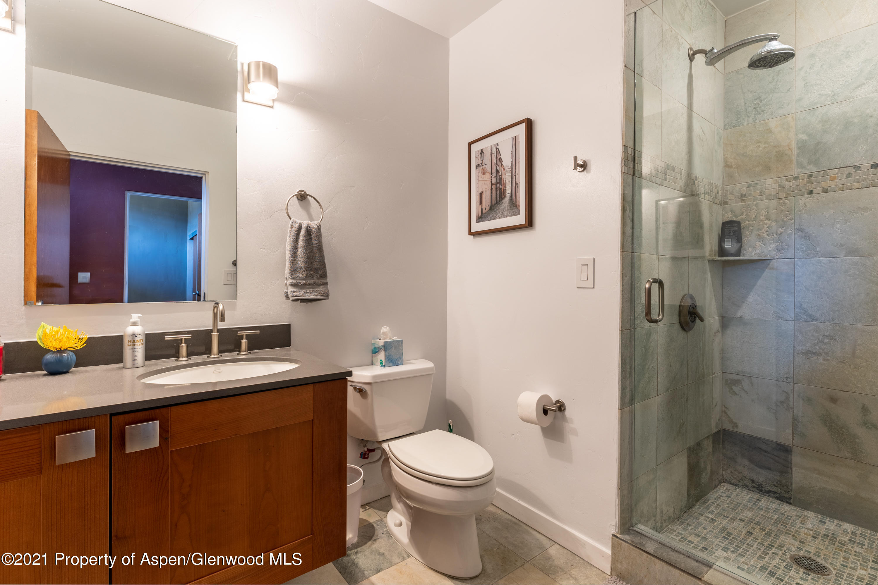 231 Robinson Street, Unit 306 Basalt, CO 81621 - Photo 9 of 15 a bathroom with a toilet sink shower and mirror