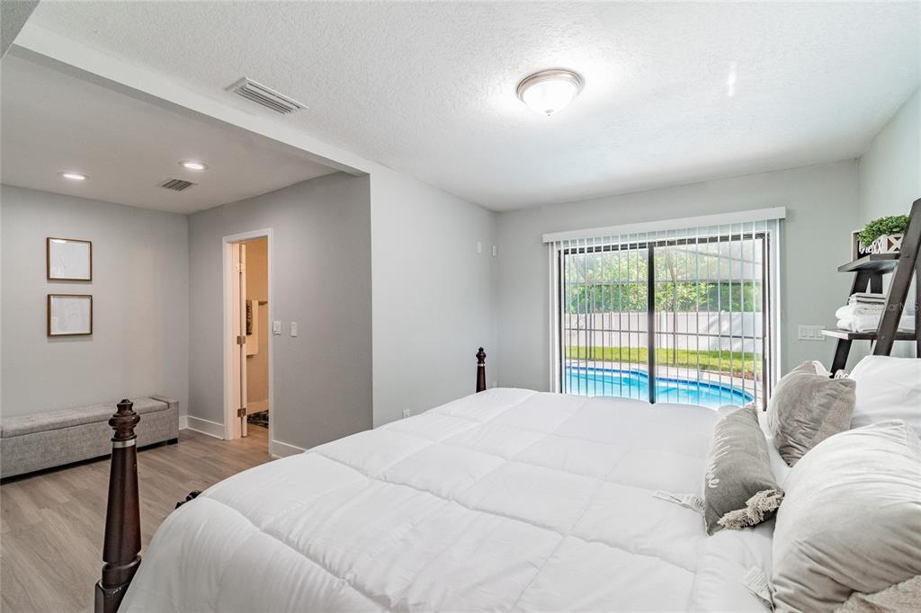 14003 Ridgedale Way Tampa, FL 33625 - Photo 14 of 28 a bedroom with a bed and a window