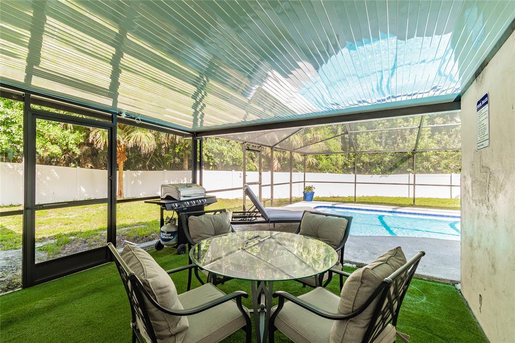 14003 Ridgedale Way Tampa, FL 33625 - Photo 24 of 28 a dining room with furniture a rug and a large window