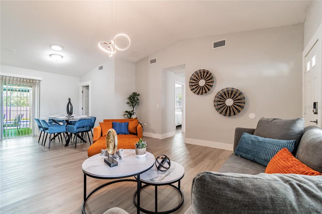 14003 Ridgedale Way Tampa, FL 33625 - Photo 9 of 28 a living room with furniture and a wooden floor