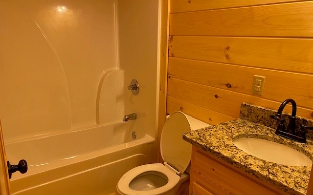 237 Bentley Cove Murphy, NC 28906 - Photo 23 of 35 a bathroom with a granite countertop sink toilet and shower