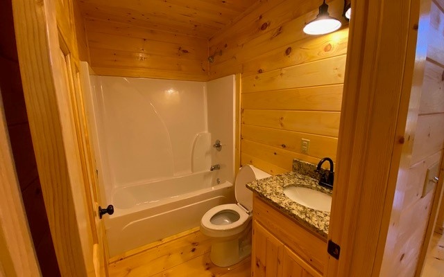 237 Bentley Cove Murphy, NC 28906 - Photo 31 of 35 a bathroom with a granite countertop sink and a mirror