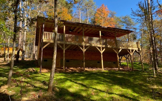 237 Bentley Cove Murphy, NC 28906 - Photo 5 of 35 a view of a chairs and table in the backyard