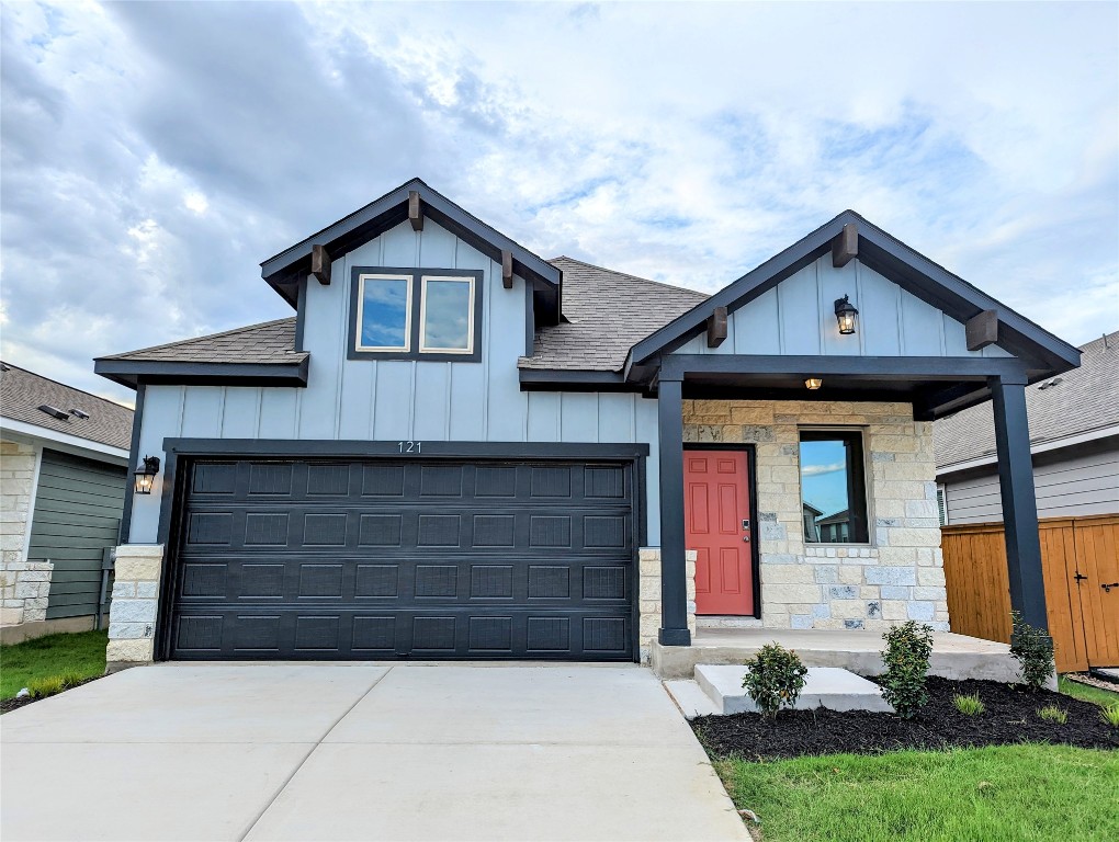 121 Drifter Lane Jarrell, TX 76537 - Photo 1 of 17 a front view of a house with a yard and garage