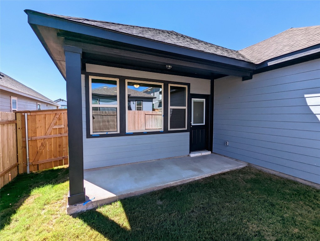 121 Drifter Lane Jarrell, TX 76537 - Photo 14 of 17 a front view of a house with garden