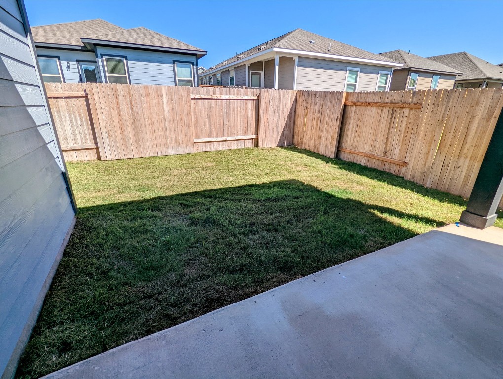 121 Drifter Lane Jarrell, TX 76537 - Photo 15 of 17 a view of a house with backyard and wooden fence