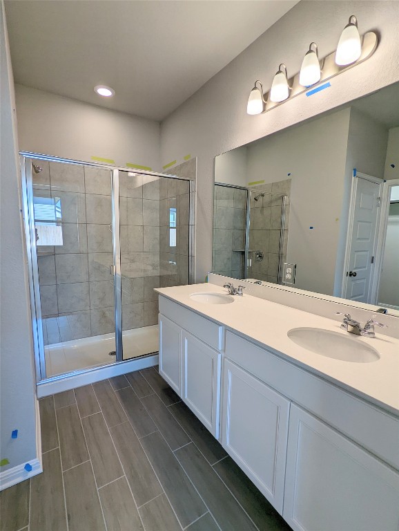 121 Drifter Lane Jarrell, TX 76537 - Photo 7 of 17 a bathroom with a tub sink shower and mirror