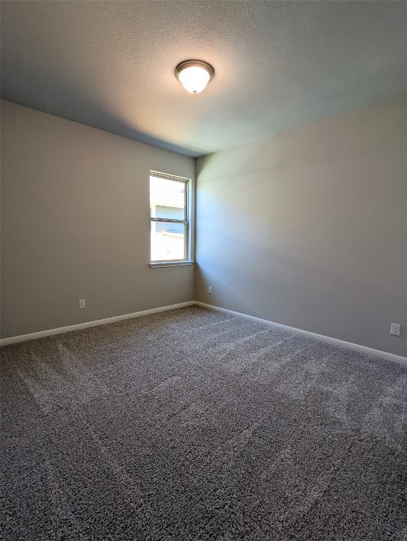 121 Drifter Lane Jarrell, TX 76537 - Photo 9 of 17 an empty room with a empty space and windows