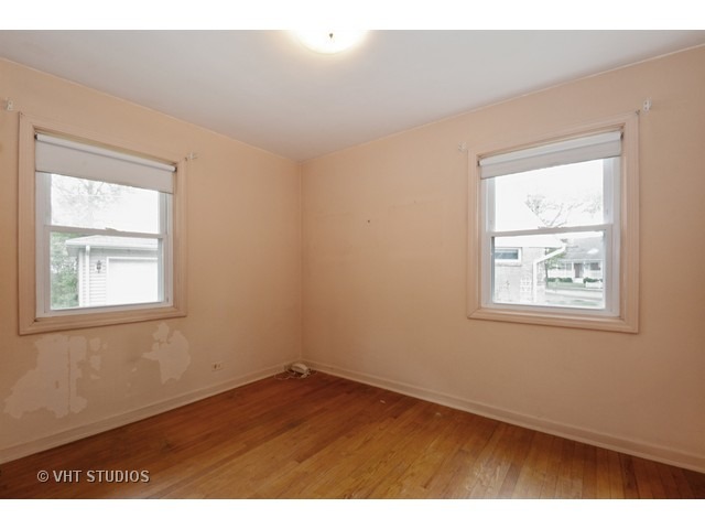2052 Downey Road Homewood, IL 60430 - Photo 7 of 10 an empty room with a window