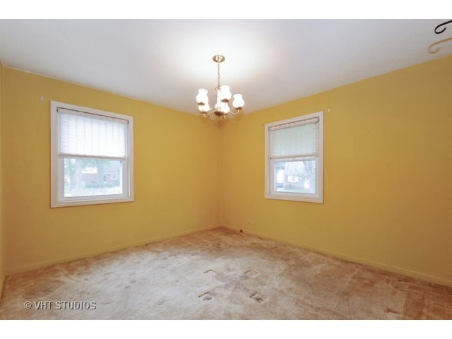 2052 Downey Road Homewood, IL 60430 - Photo 8 of 10 a view of livingroom with chandelier