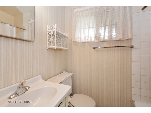 2052 Downey Road Homewood, IL 60430 - Photo 10 of 10 a bathroom with a sink and a mirror