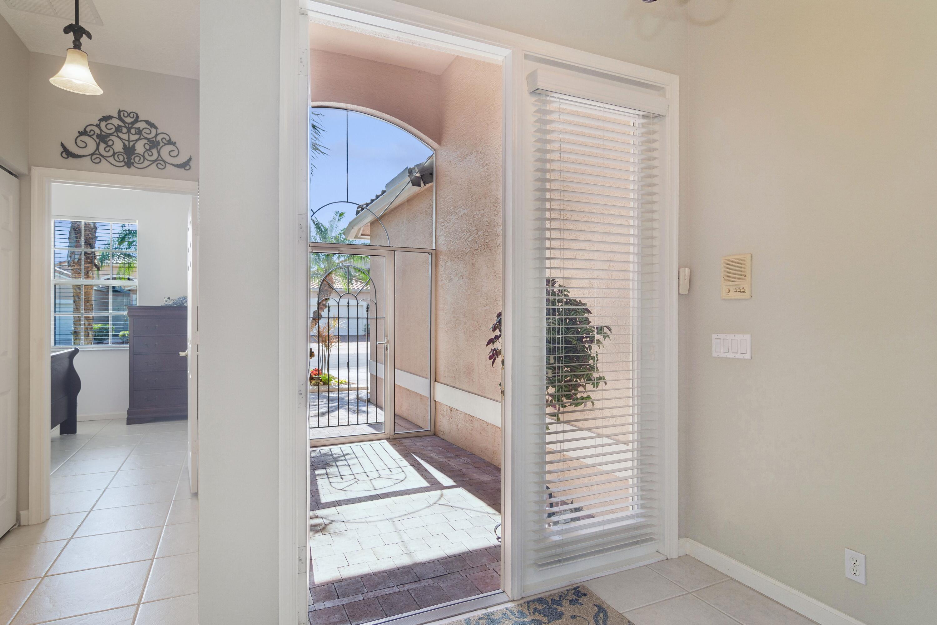 401 Springview Loop Port St. Lucie, FL 34986 - Photo 2 of 54 02_401NWSpringviewLoop_84_Entryway_HiRes