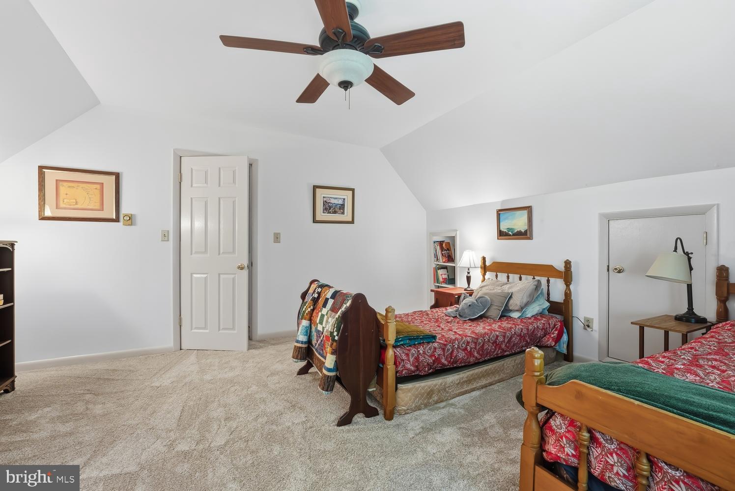 814 Wrights Neck Road Centreville, MD 21617 - Photo 48 of 53 a bedroom with bed and a chandelier