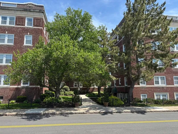 a front view of a building with street view