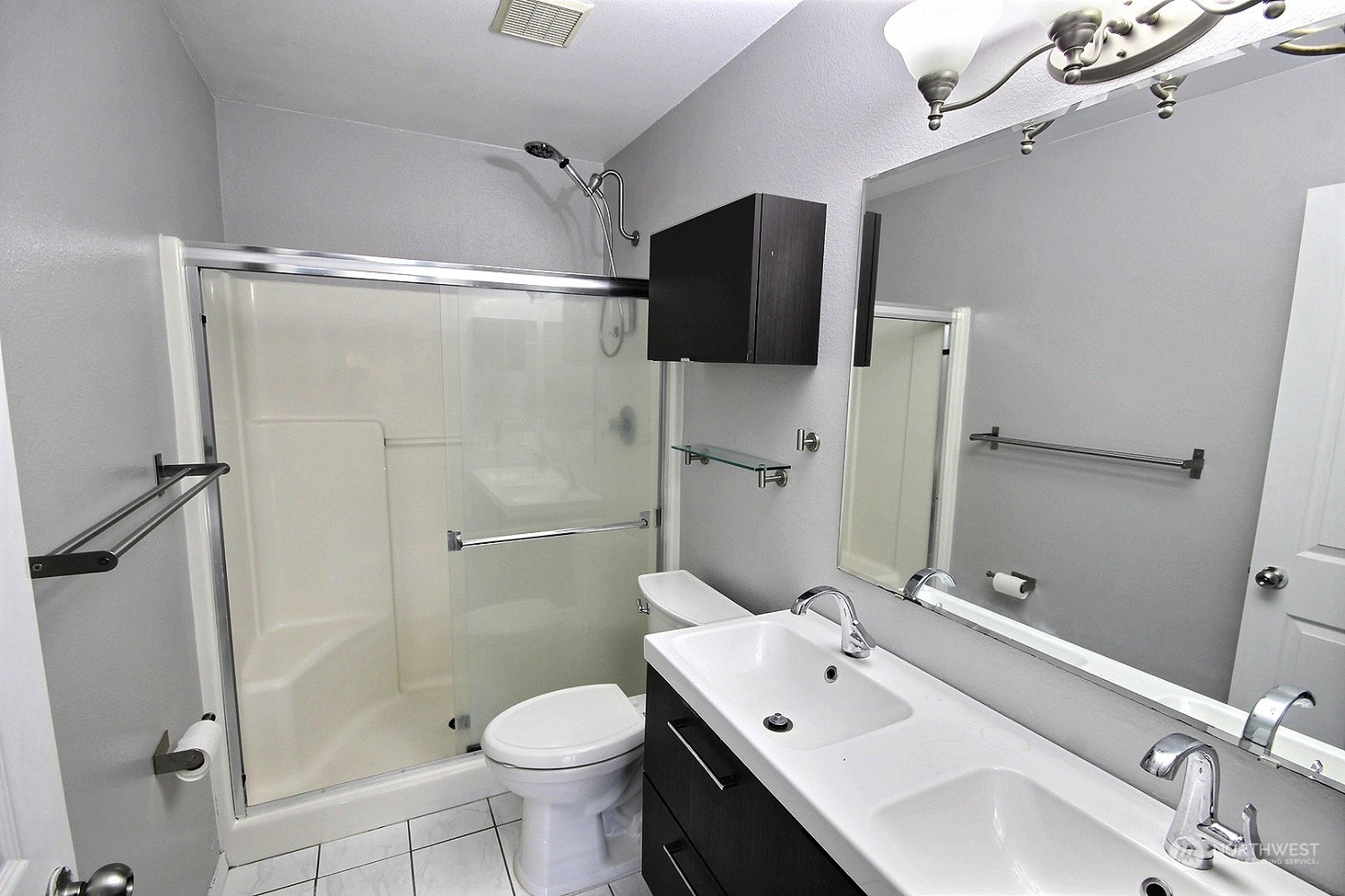 1826 Kennedy Place, Unit D7 DuPont, WA 98327 - Photo 13 of 19 a bathroom with a sink toilet and shower