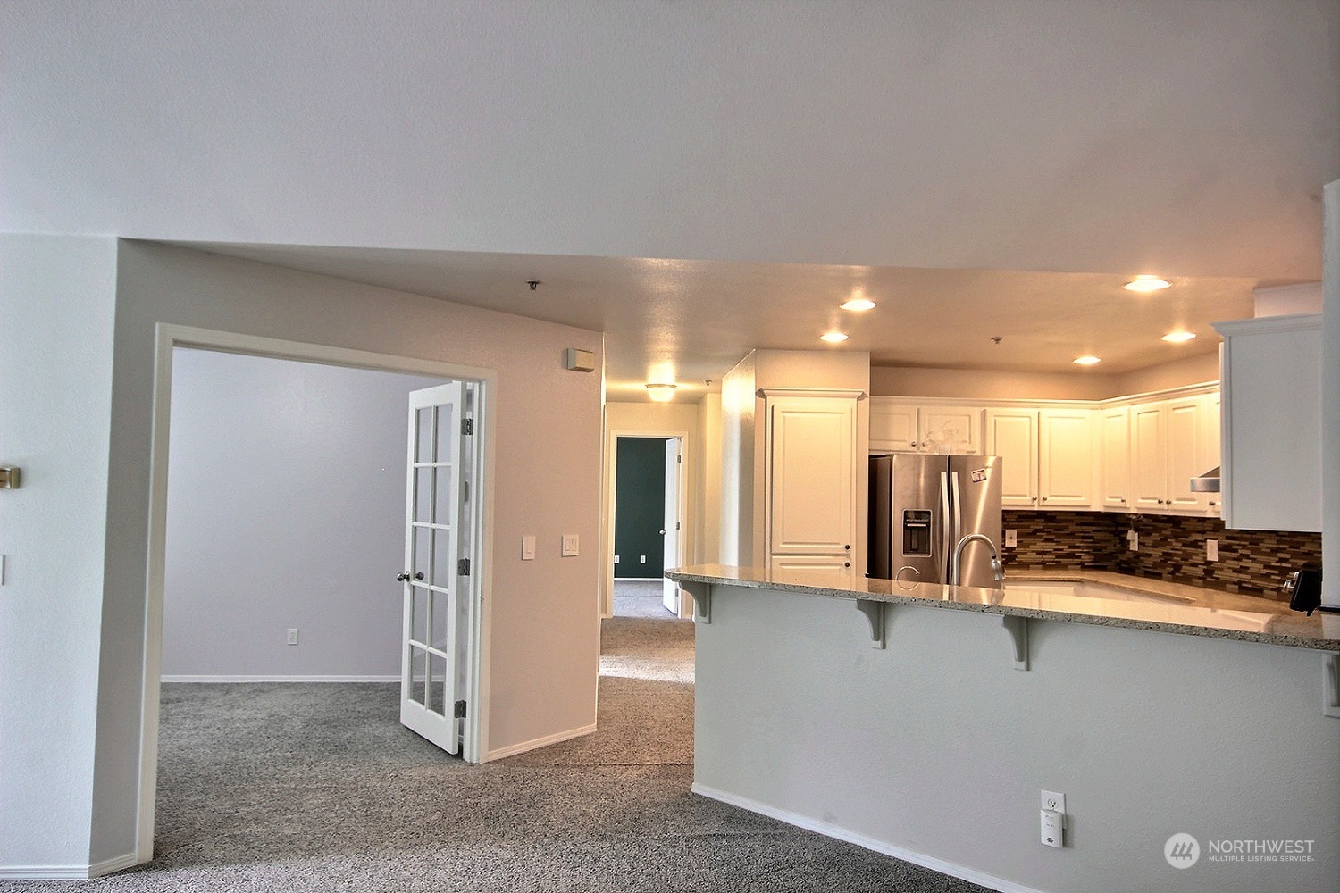 1826 Kennedy Place, Unit D7 DuPont, WA 98327 - Photo 3 of 19 a view of a large kitchen with a large window