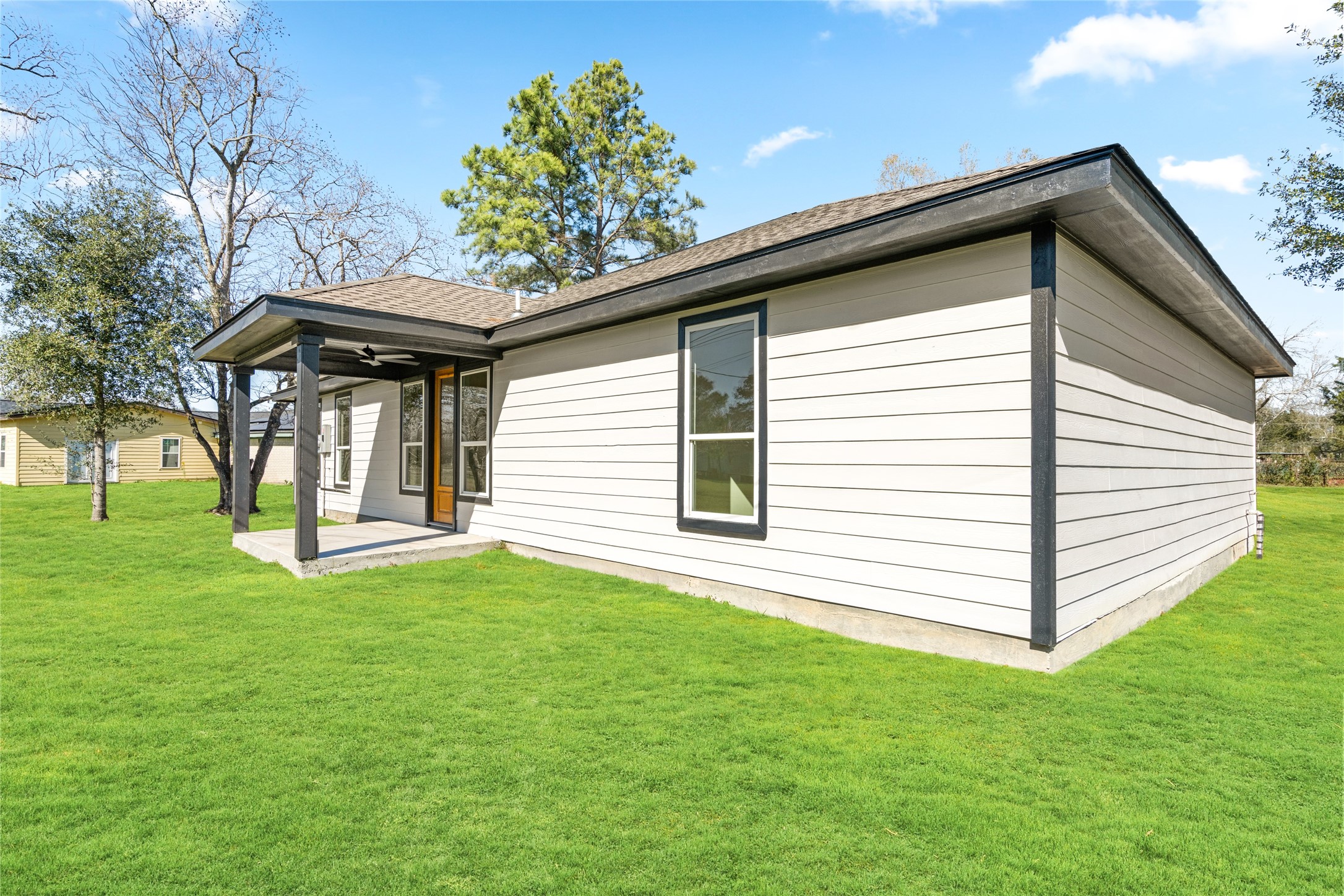 4654 North Teague Street Rosharon, TX 77583 - Photo 41 of 46 Exterior rear view showcasing the home’s modern lines and expansive backyard—perfect for entertaining or relaxing outdoors.