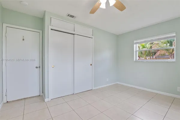 a view of an empty room with a window