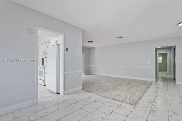 a kitchen with cabinets and window