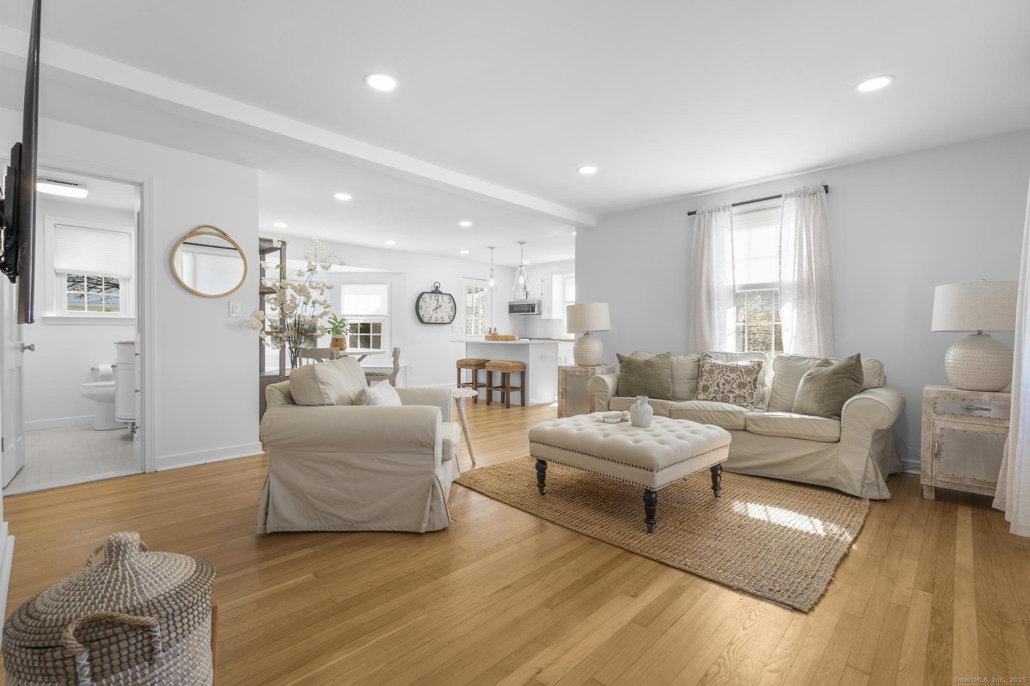 27 Reef Court Fairfield, CT 06824 - Photo 15 of 23 a living room with furniture and a large window