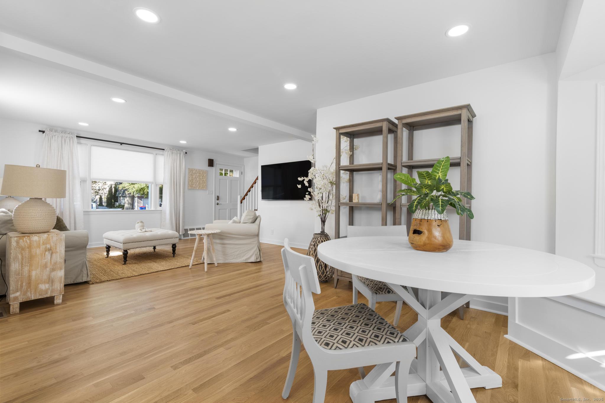 27 Reef Court Fairfield, CT 06824 - Photo 8 of 23 a living room with furniture and a wooden floor