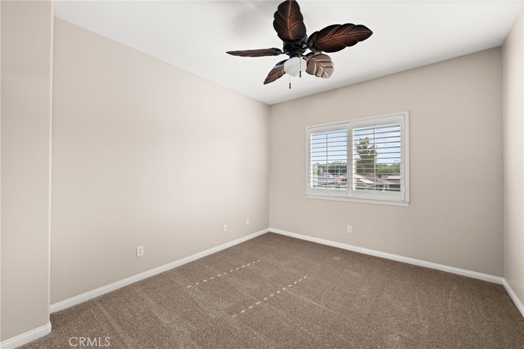 15868 Shorb Street Riverside, CA 92508 - Photo 10 of 15 an empty room with a window