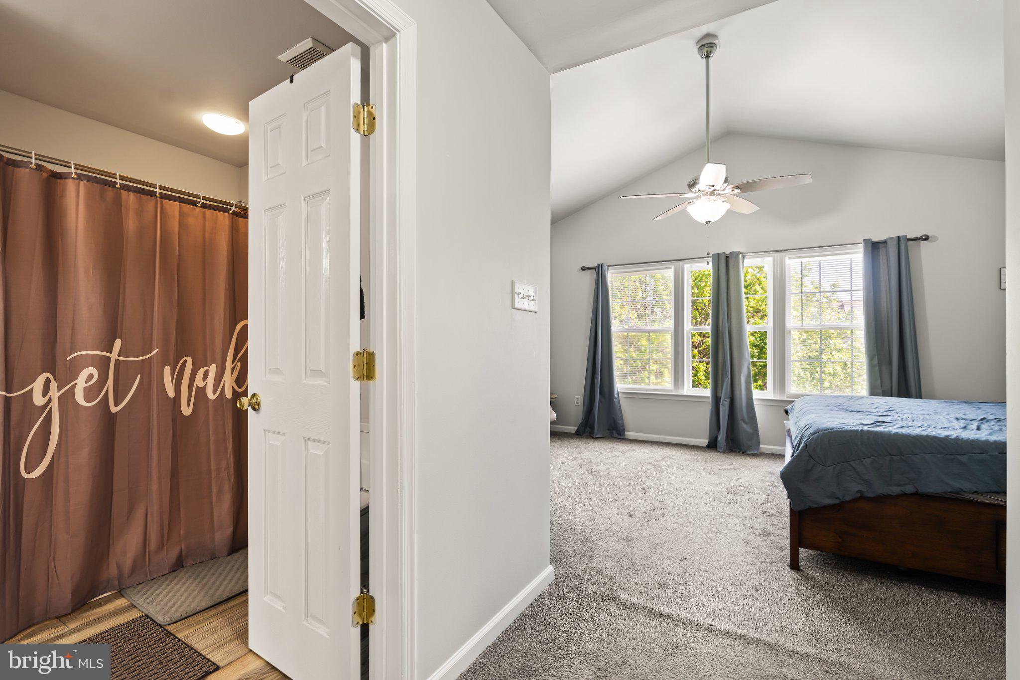 128 Sentry Ridge Smithsburg, MD 21783 - Photo 23 of 41 a spacious bedroom with a large bed and a chandelier