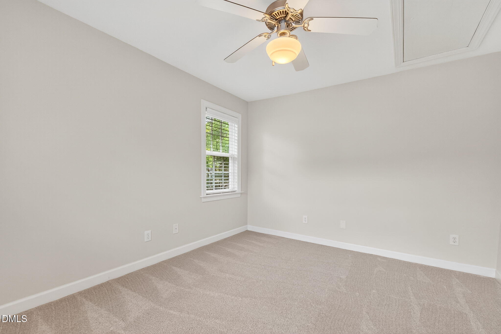 4720 All Points View Way Raleigh, NC 27614 - Photo 24 of 39 an empty room with a window and chandelier