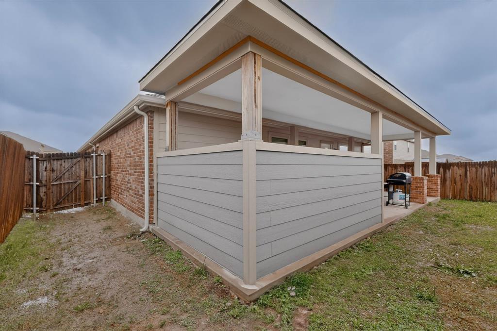 1409 Slate Street Princeton, TX 75407 - Photo 36 of 36 Covered patio featuring a concrete slab and support columns