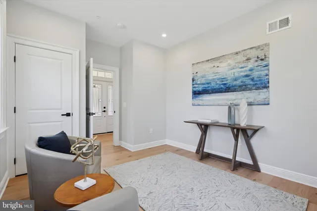 a living room with furniture and a rug