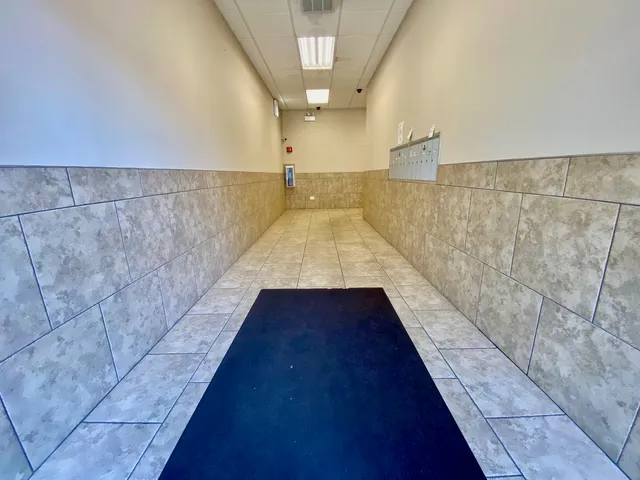 a bathroom with a shower and a sink