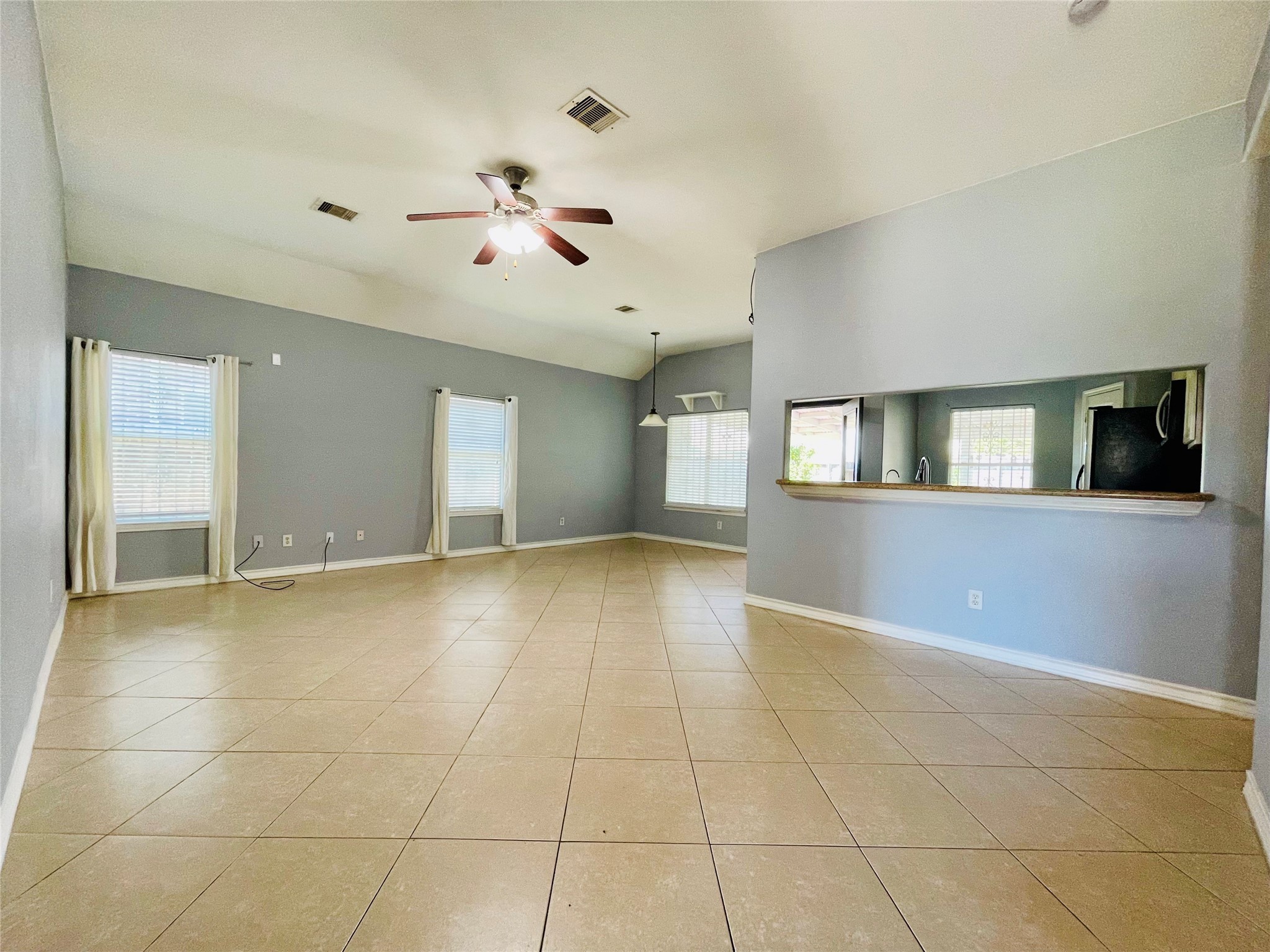13739 Canyon Hollow Loop Houston, TX 77083 - Photo 4 of 14 a view of an empty room with a fireplace and a window