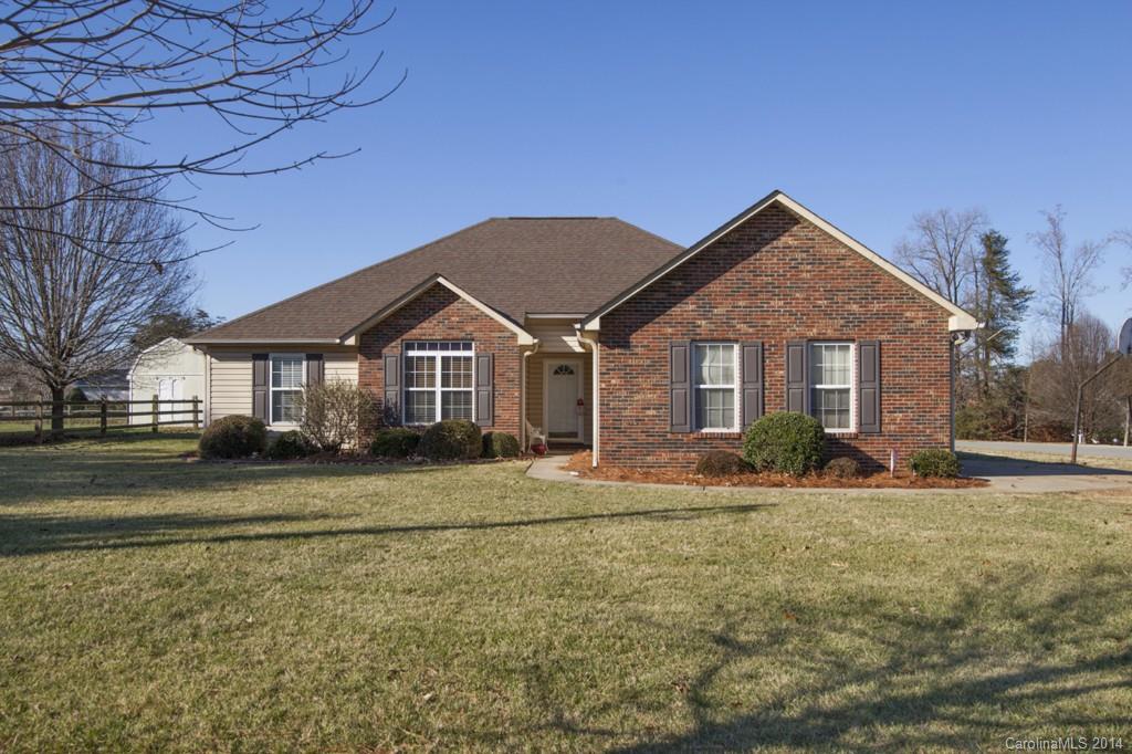 146 State Park Road Troutman, NC 28166 - Photo 1 of 18 a front view of a house with a yard