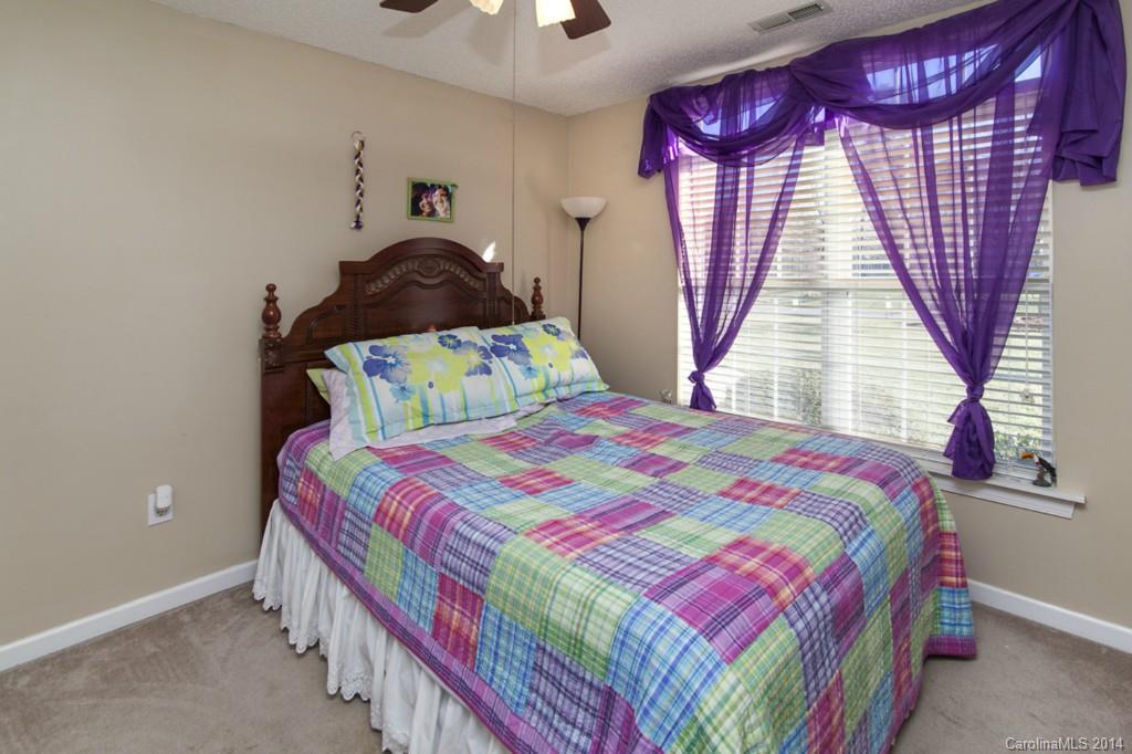 146 State Park Road Troutman, NC 28166 - Photo 11 of 18 a bedroom with a bed and a window