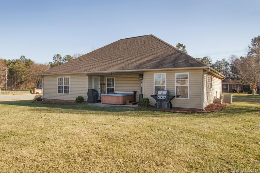 146 State Park Road Troutman, NC 28166 - Photo 16 of 18 a view of a house with a patio