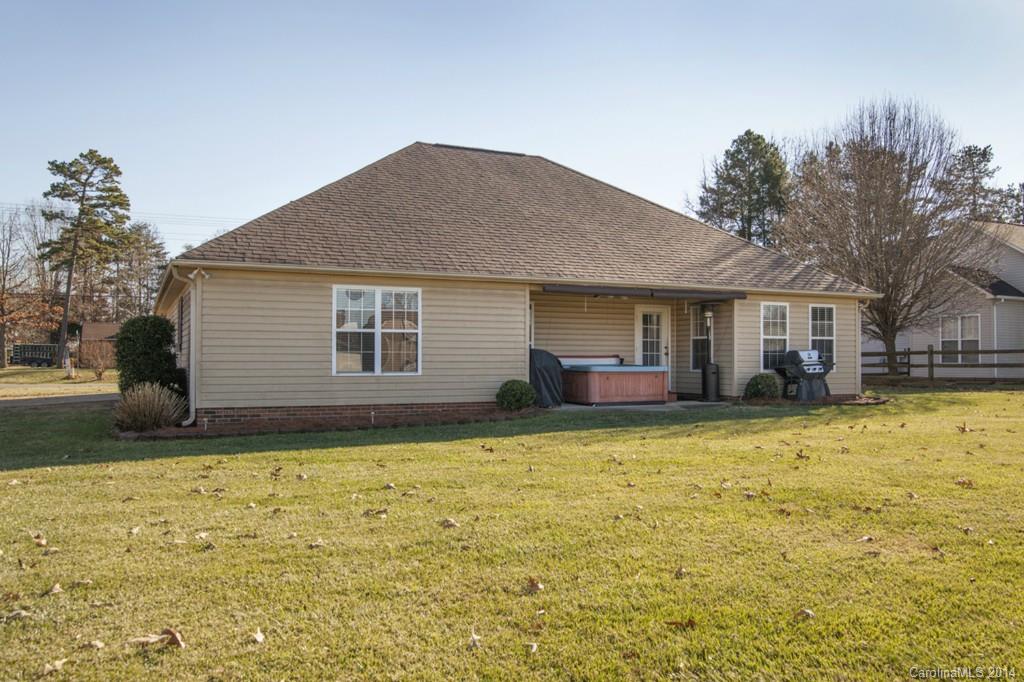 146 State Park Road Troutman, NC 28166 - Photo 17 of 18 a front view of a house with a garden