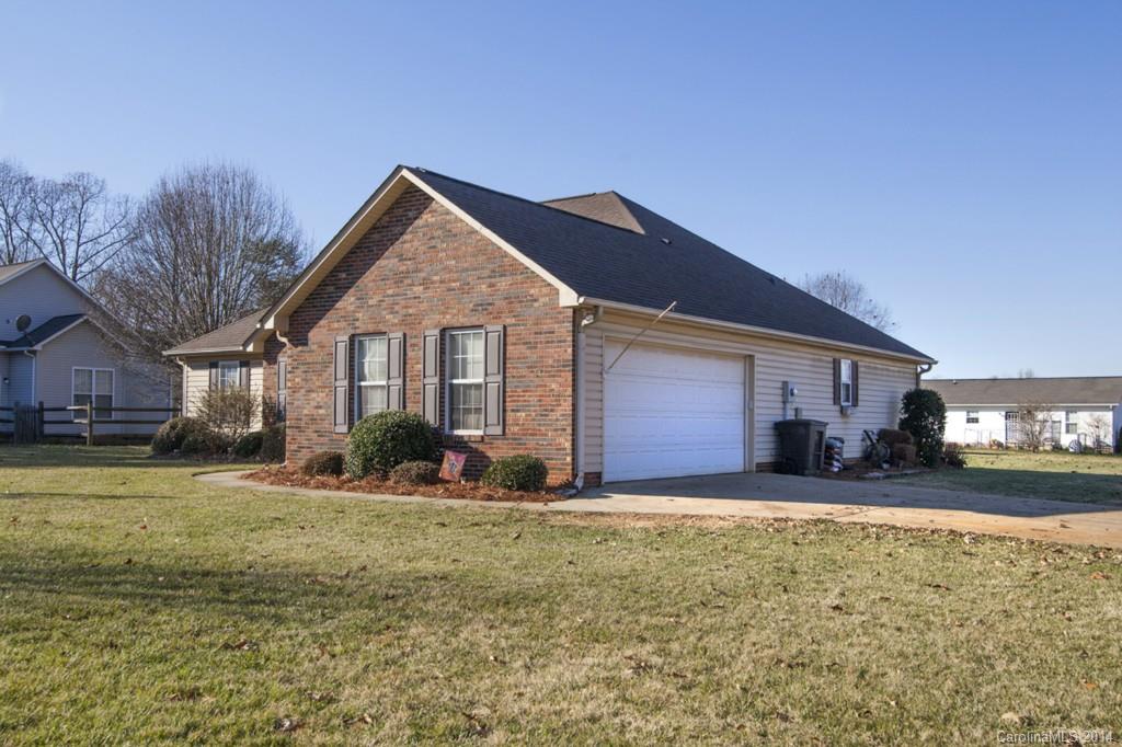 146 State Park Road Troutman, NC 28166 - Photo 18 of 18 a front view of a house with a yard