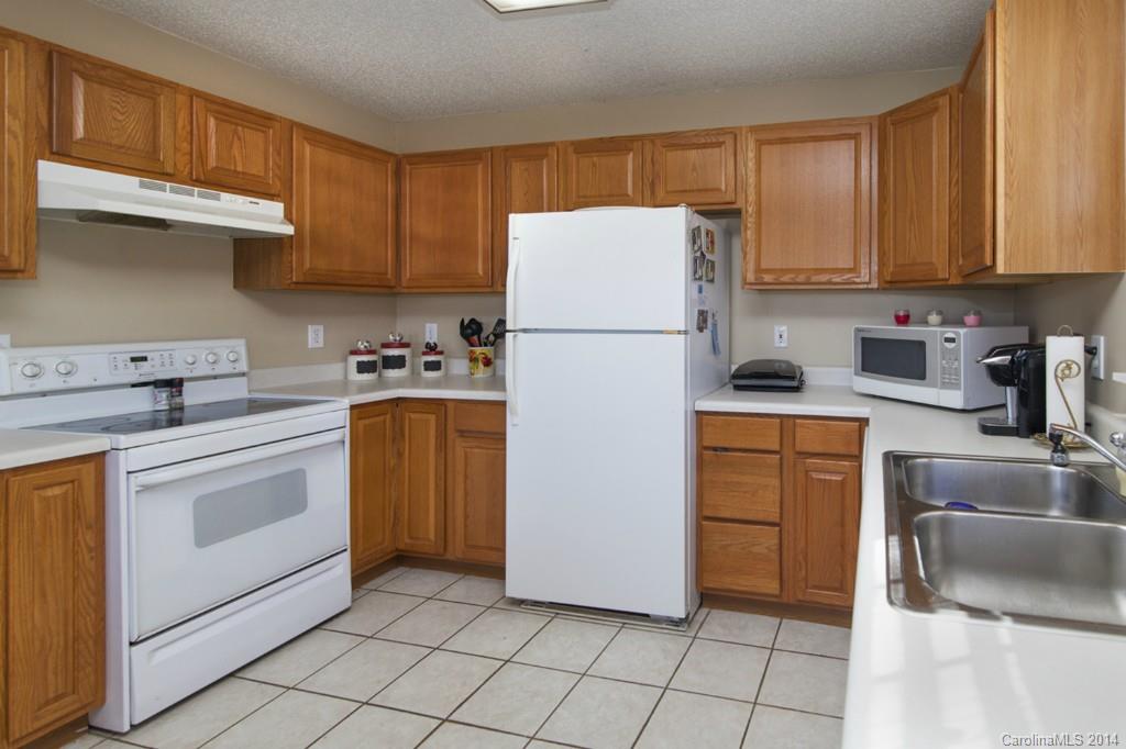 146 State Park Road Troutman, NC 28166 - Photo 7 of 18 a kitchen with appliances a sink and cabinets