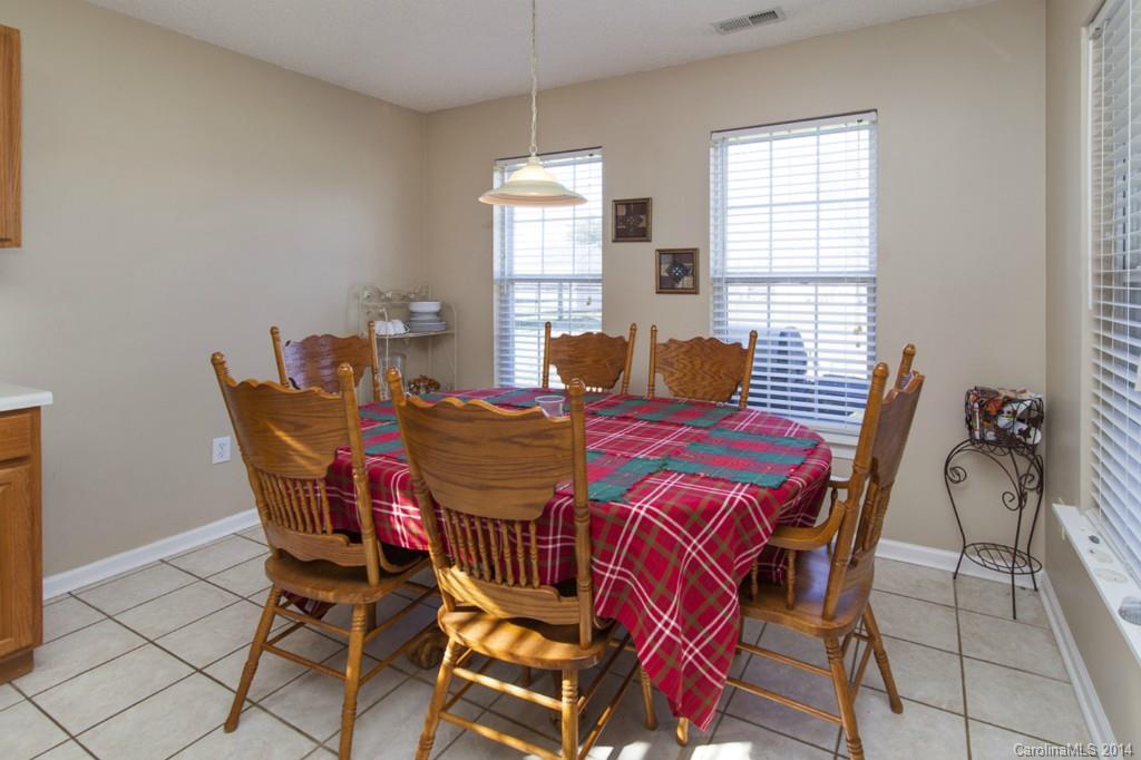 146 State Park Road Troutman, NC 28166 - Photo 8 of 18 a view of a dining room with furniture window and outside view