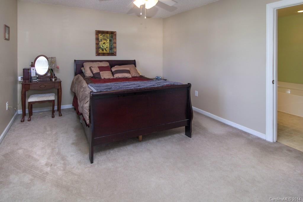 146 State Park Road Troutman, NC 28166 - Photo 9 of 18 a living room with furniture and a chandelier