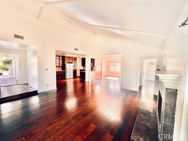 a view interior of a house with wooden floor and a fireplace