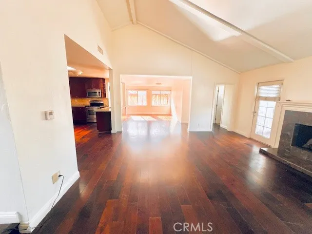 a view of livingroom with hardwood floor and a sink