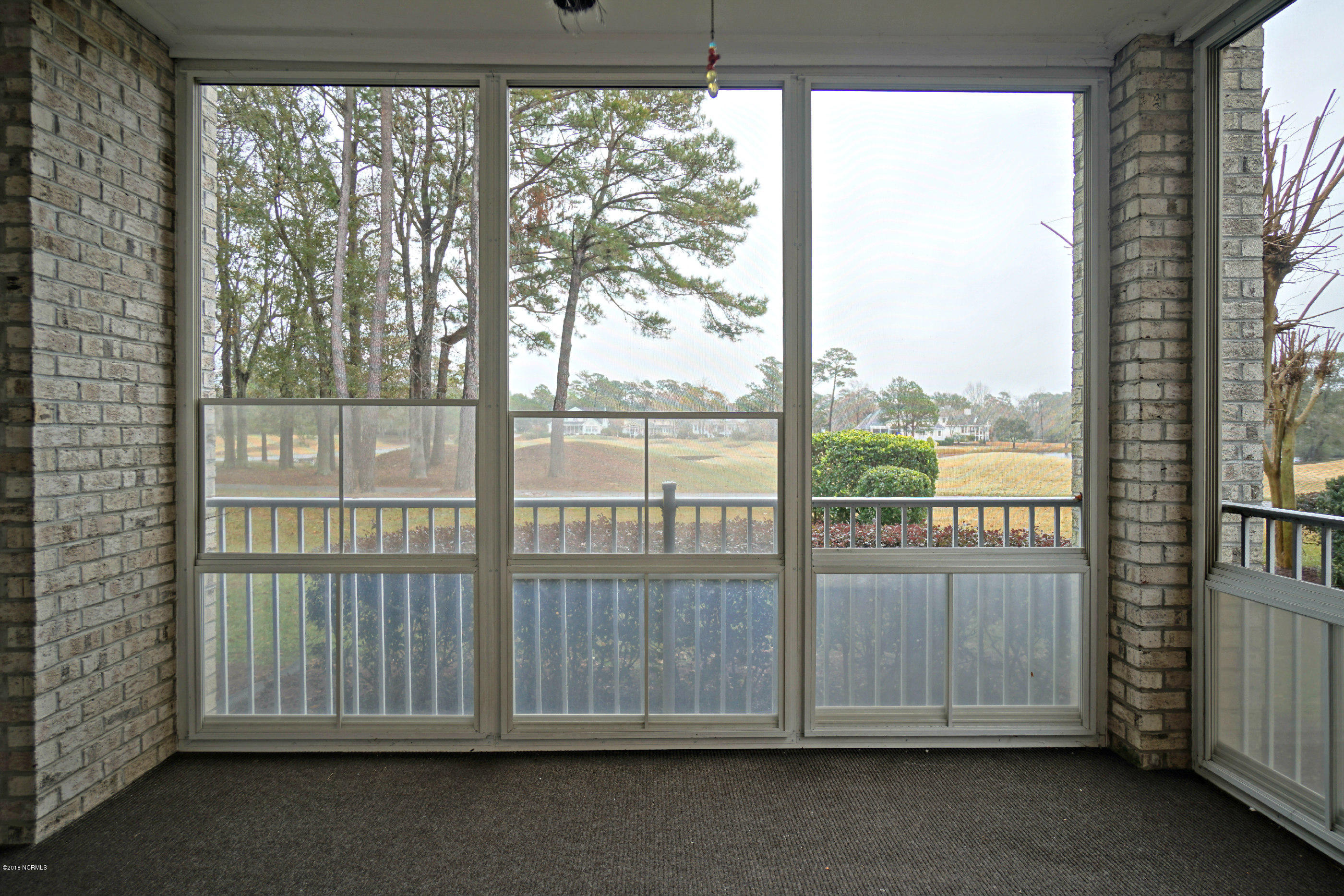 172 Clubhouse Road, Unit 2 Sunset Beach, NC 28468 - Photo 25 of 28 Screened Porch 2