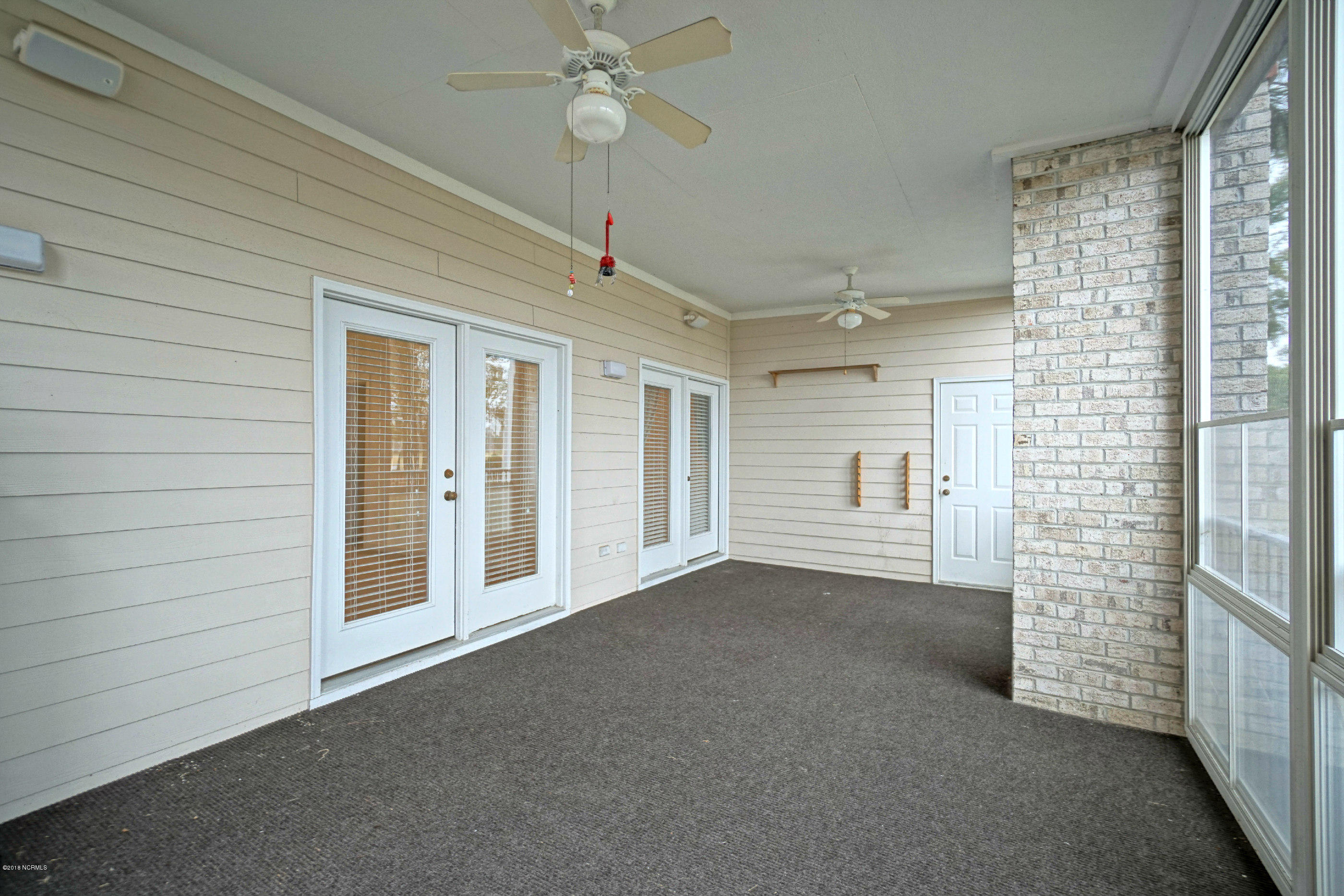 172 Clubhouse Road, Unit 2 Sunset Beach, NC 28468 - Photo 26 of 28 Screened Porch 3