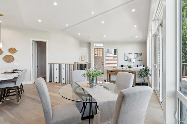 a kitchen with stainless steel appliances a sink a stove and a wooden floors